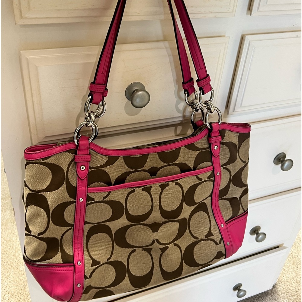 Lightly used Coach purse with matching wallet in pink.